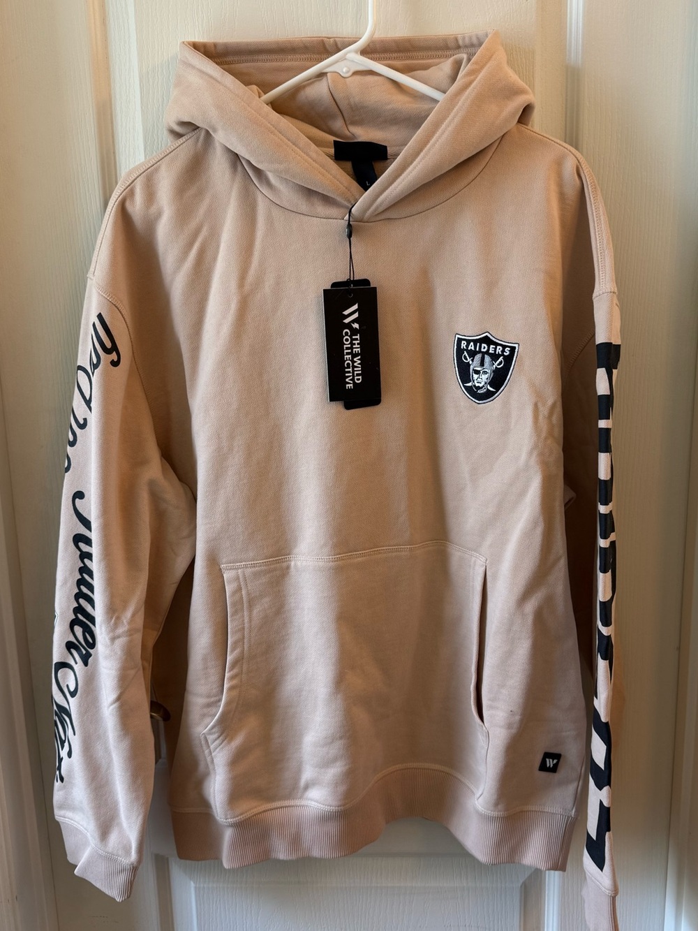 The Wild Collective Raiders Beige Hoodie with Patch and Sleeve Graphics